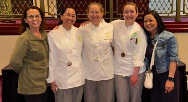 Chef Karen, Jude Dreiflyn Solian, Cara Strasser, Gianna Logrecco, and Ann Barkdull stand smiling together after a victorious SkillsUSA competition.