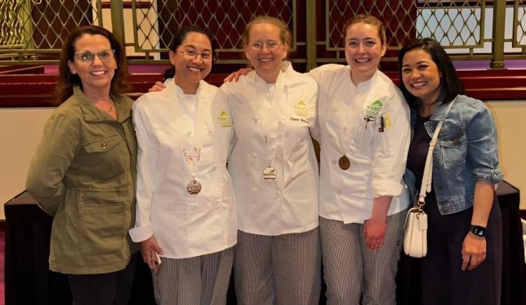 Chef Karen, Jude Dreiflyn Solian, Cara Strasser, Gianna Logrecco, and Ann Barkdull stand smiling together after a victorious SkillsUSA competition.