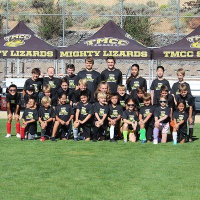 Youth Camp participants gather for a photo on the TMCC Soccer Field.