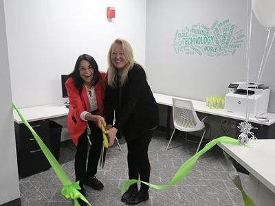 TMCC President Dr. Karin Hilgersom and Cheryl Jones cut the honorary ribbon, formally opening the IT Nexus.