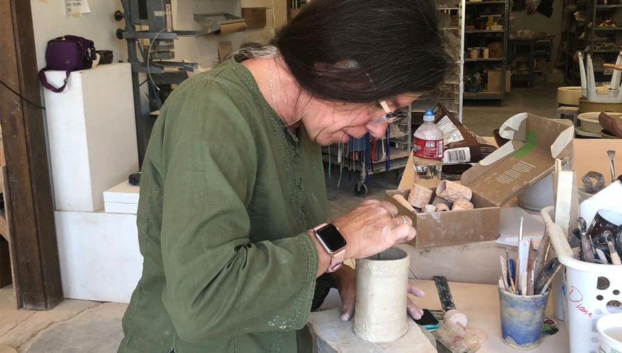 Diana Keef-Adams at work on a ceramic project.