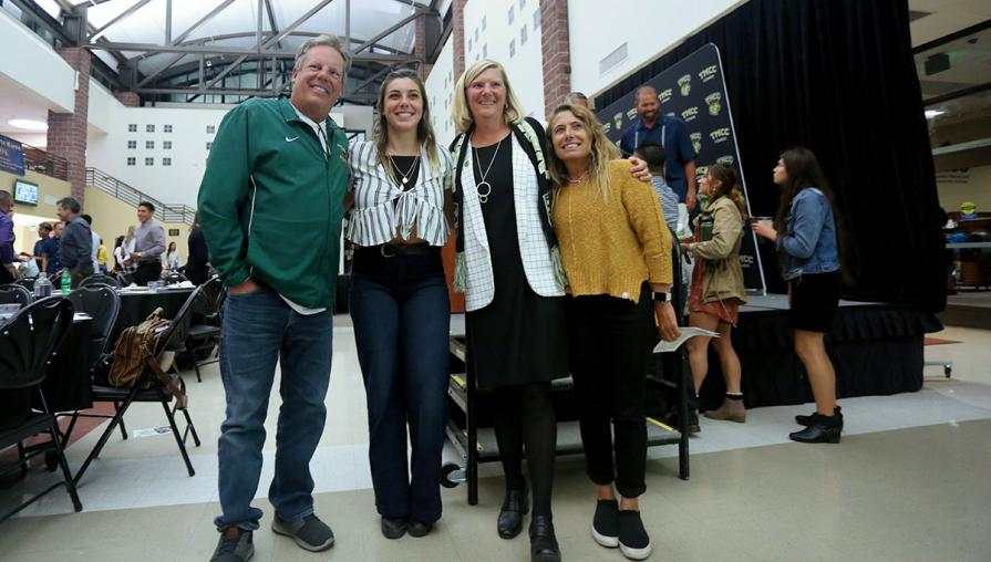 Samantha Lampe and her parents with Tina Ruff.