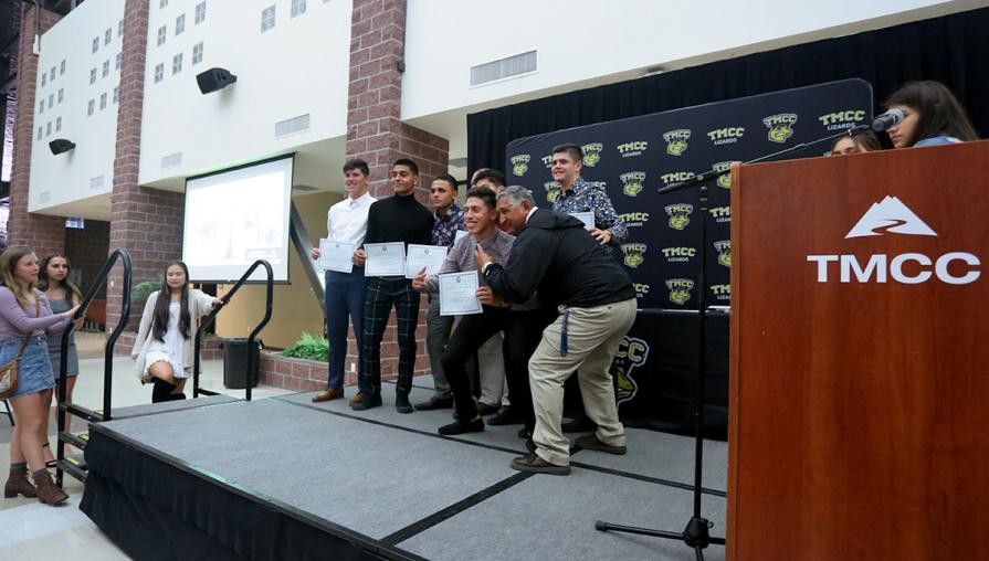 Members of the men’s soccer team with Coach Gonzalo Lopez.