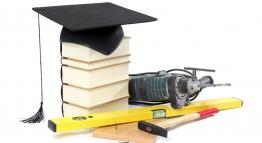 Image of books and a graduation hat.
