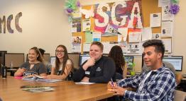 SGA members sit at a meeting.