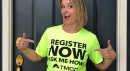 A woman wearing a t-shirt that says Register Now, Ask Me How.