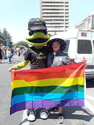 TMCC Mascot Wizard the Lizard with pride flag