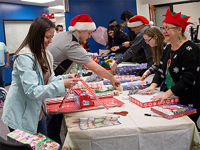 Staff and Students Wrap Gifts Image