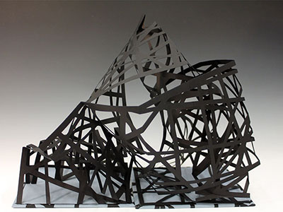 Photograph of sculpture constructed of strips of paper.