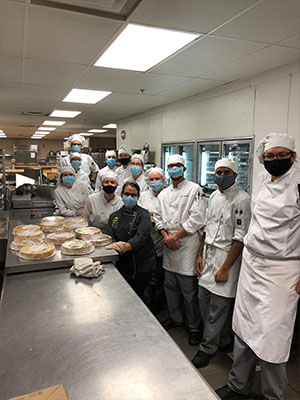 Culinary students wearing their uniforms.