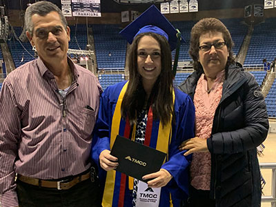 Becerra with her parents at 2019 commencement.