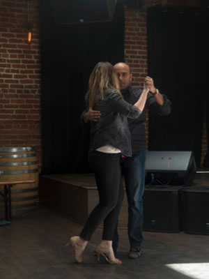 Atanasiu and companion perform tango.