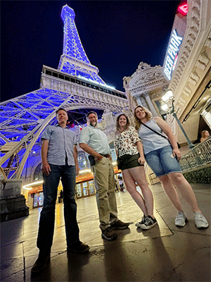 Two instructors and two student standing at night in Las Vegas.