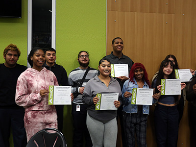 A group of students holding certificates.