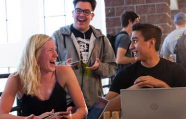 Students laughing in the Student Center.