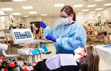 Dental Student working on a patient