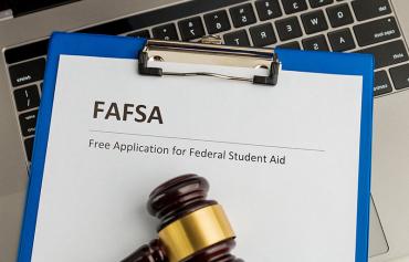 Gavel on a paper with FAFSA.