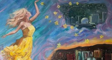 A beautiful, golden-haired woman in a yellow sundress rests daffodils above a Reno sunset and night sky. Light to Reno, by Galina Milton.