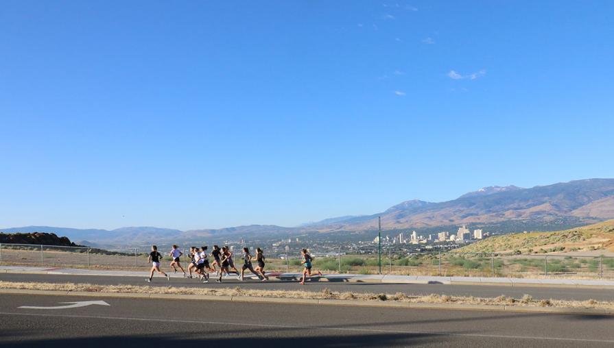 Athletes running up a hill.