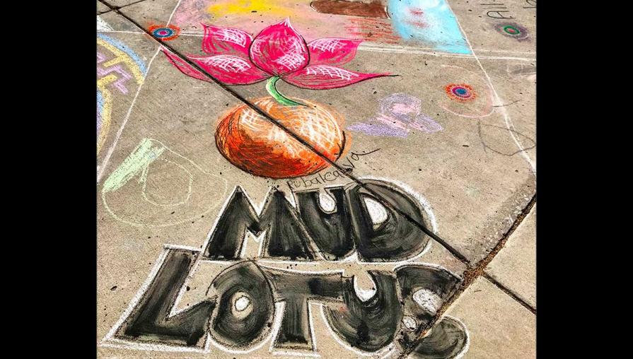 Chalk drawing of a flower and the words MUD LOTUS.