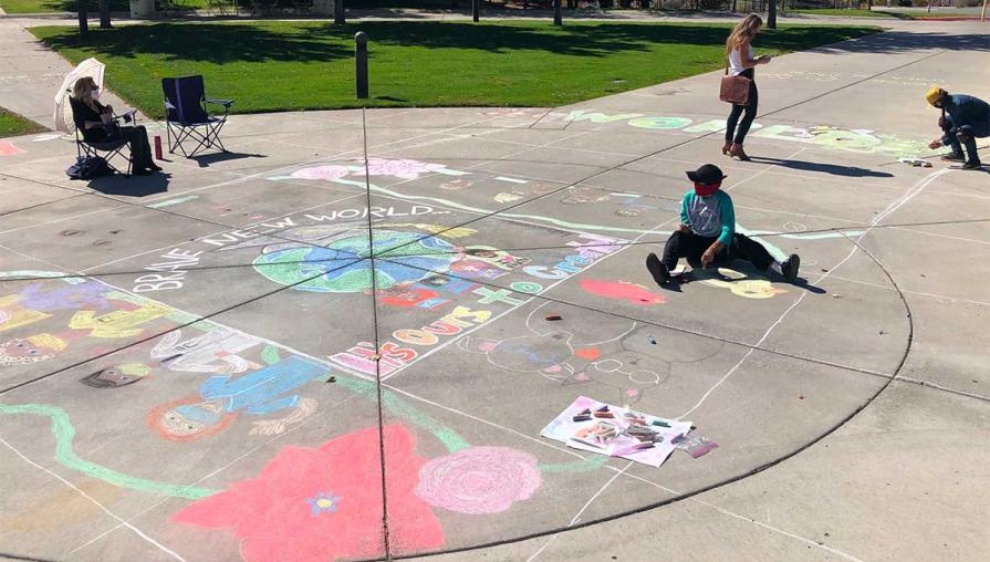 Students working on the chalk mural.