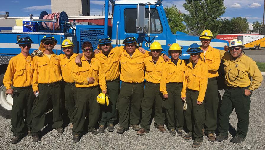 Students in the Basic Wildland Fire Academy pose in front of fire engine