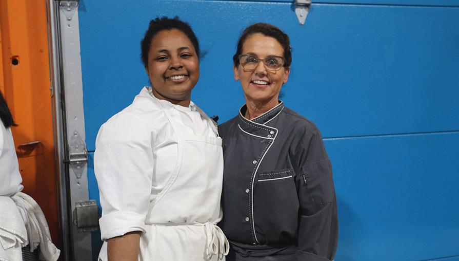 Chef Karen Cannan (right) with a Culinary Arts student at the event.