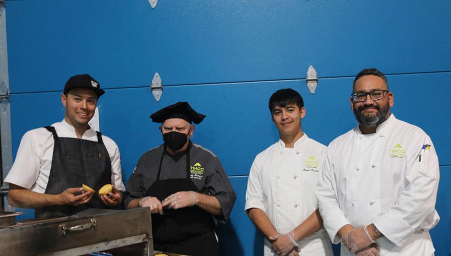 Chef Craig Rodrigue (second from left) with Culinary Arts students at the event.