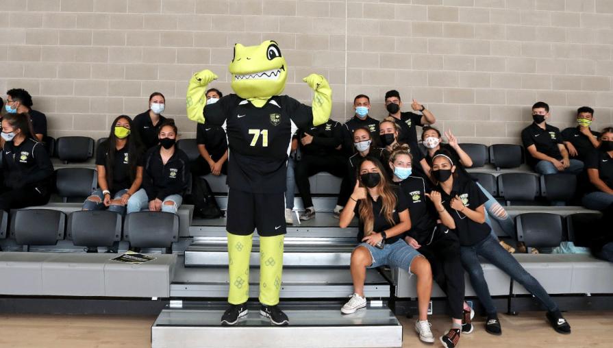 mighty, the athletics mascot, poses with tmcc student-athletes