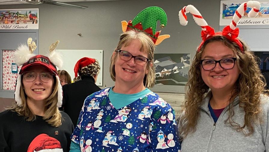 Alicia Angilley, Julie McMahon, and Jillian Fallon dressed up festively for Santa Paws event.