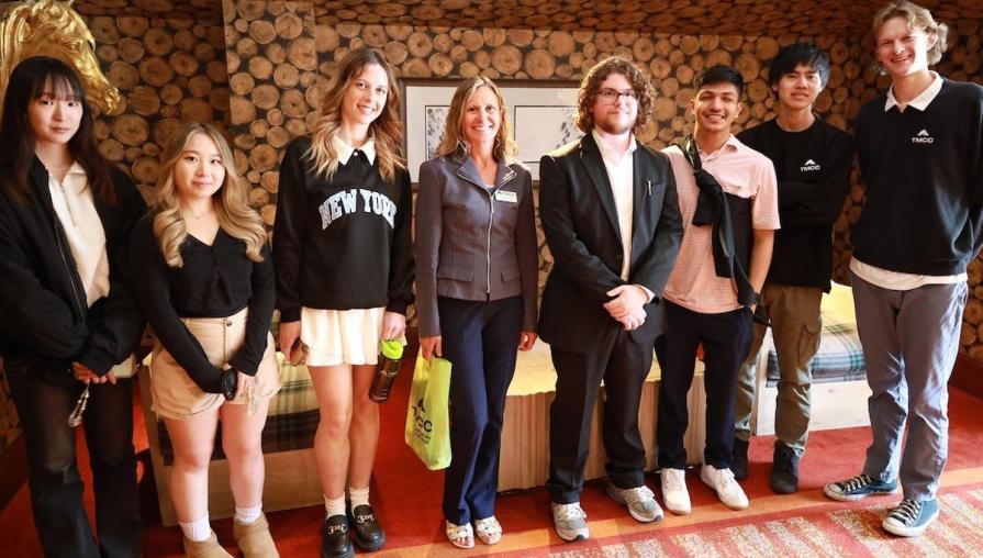 Hospitality students and their professor, Vanina Coudriet, touring the warm and refined Ritz-Carlton hotel.