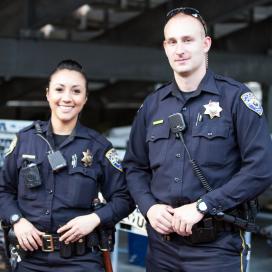 Two police officers standing next to each other