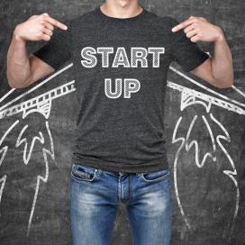 Person wearing a shirt that says start up