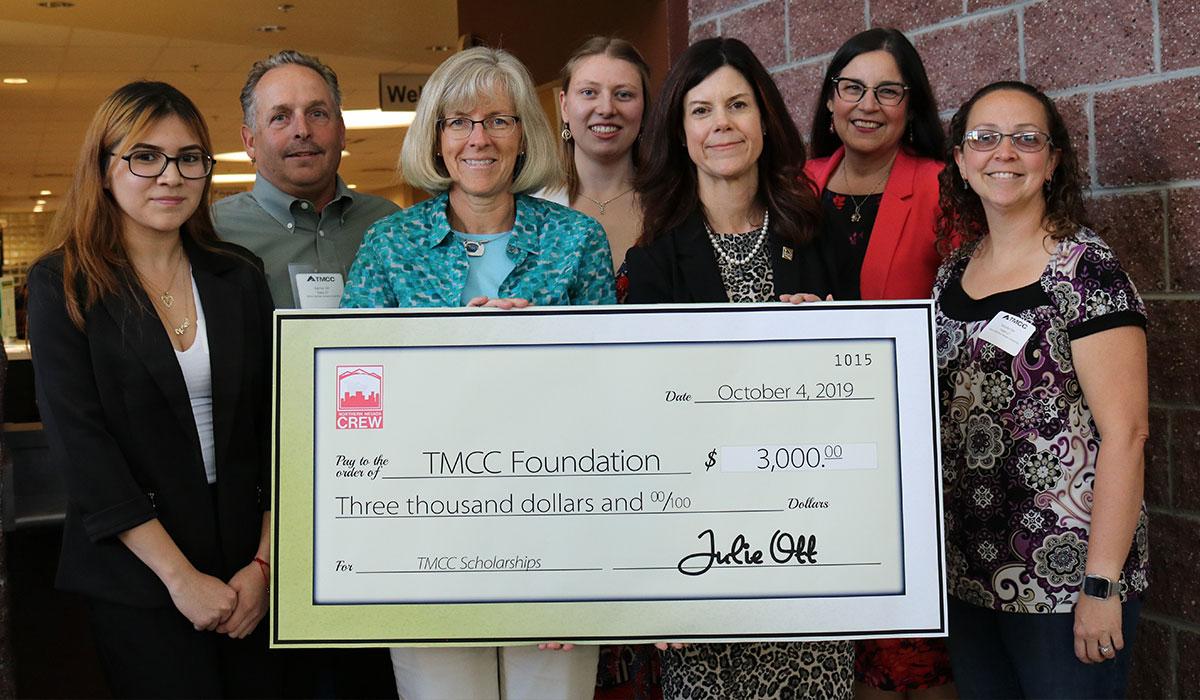 TMCC Foundation members with an oversized check from CREW.