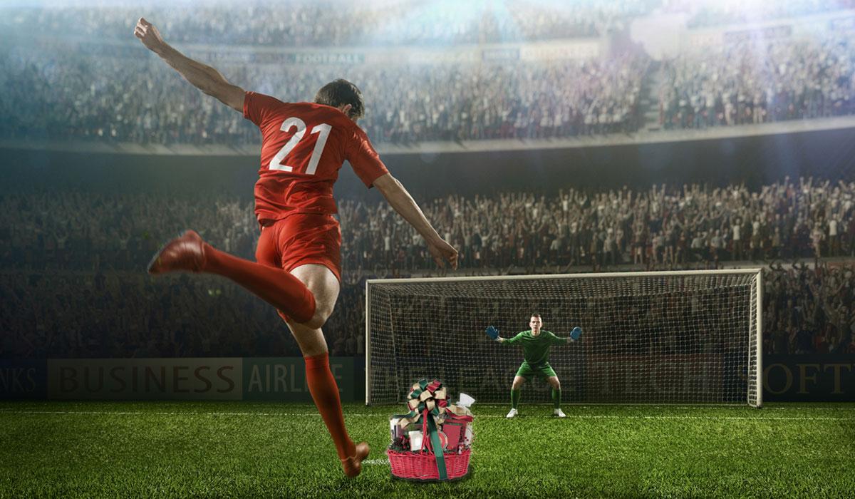 Artwork depicting a soccer player kicking a gift into a goal.