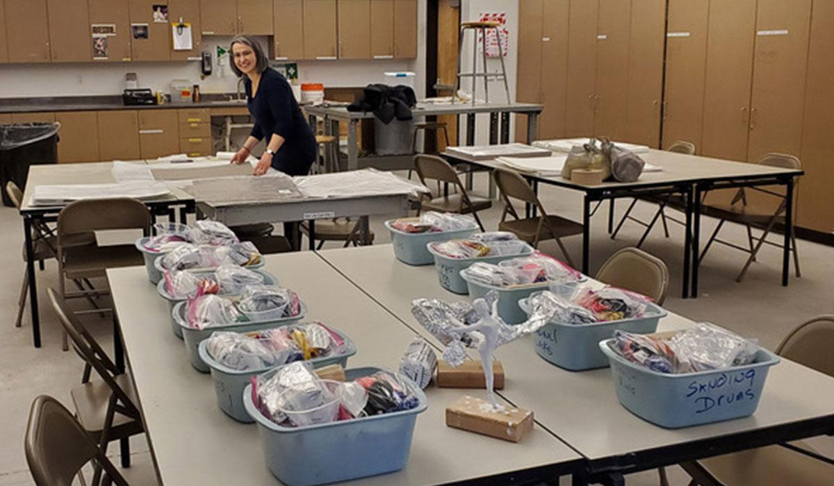 Art instructor Rossi Todorova assembles kits in the drawing studio.