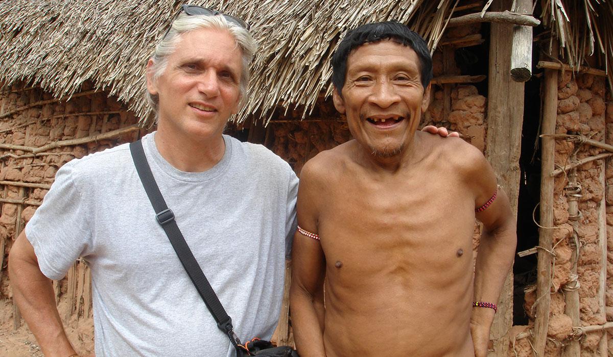 Professor Louis Forline poses with the Awá, Karapiru