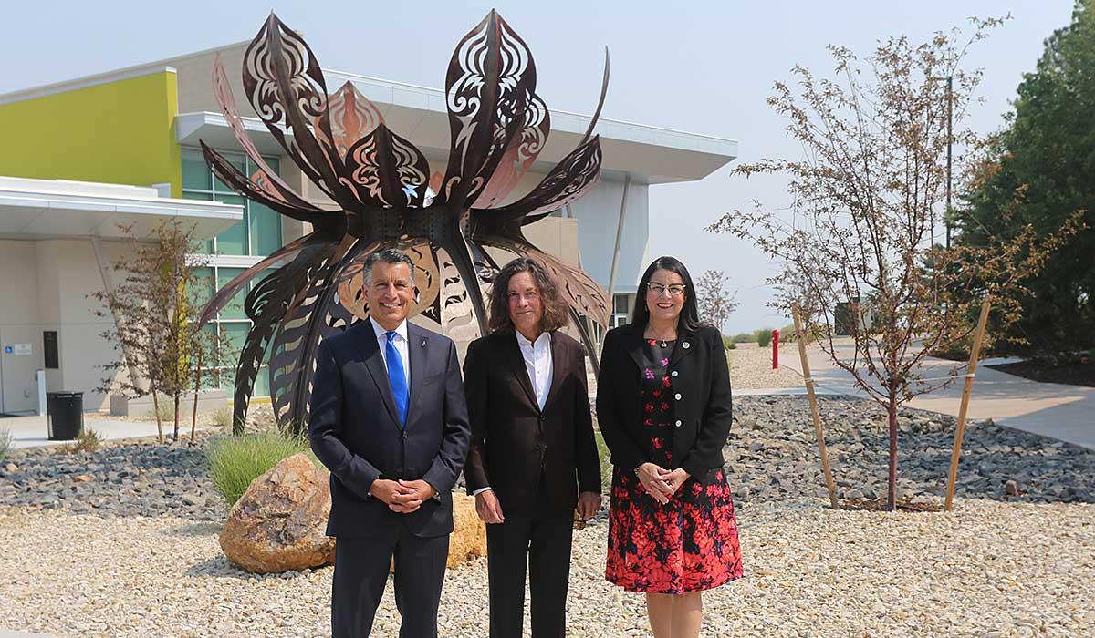 President Karin Hilgersom, President Brian Sandoval and Nevada Museum of Art CEO David B. Walker in front of the Guardian of Eden sculpture. 
