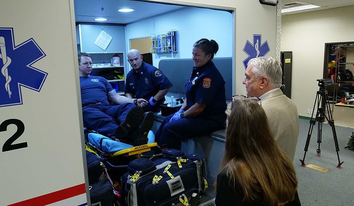 Governor Sisolak overseeing students training in an ambulance. 