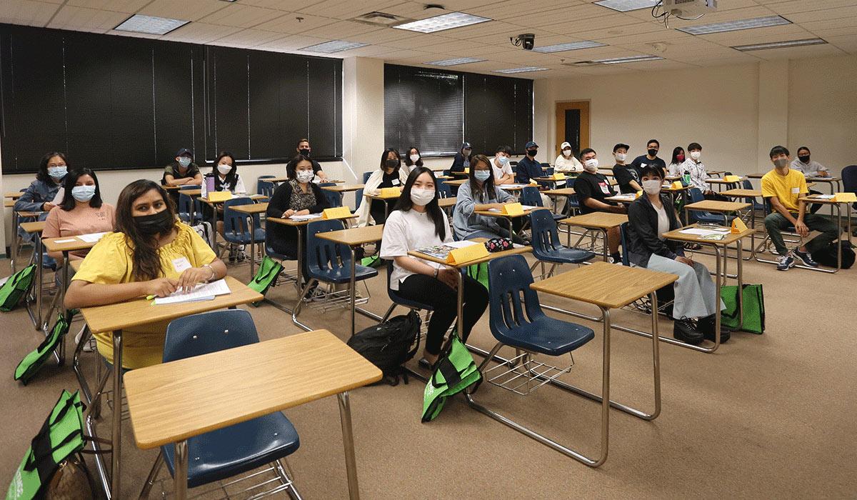 international students attend orientation in classroom