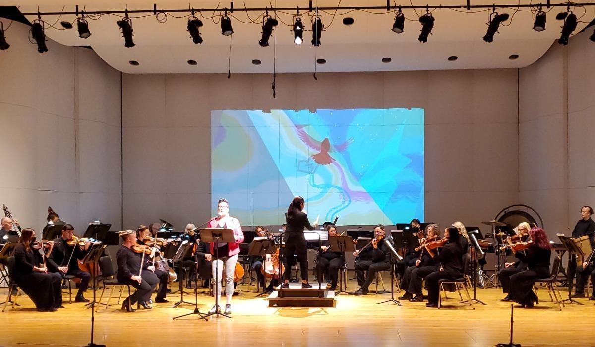 Caroline Shaw conducts the Reno Chamber Orchestra alongside the visual storytelling of "The Mountain That Loved a Bird" at Nightingale Concert Hall.