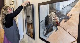 TMCC photography student hangs her work in an exhibit entitled "Street." 