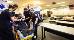 Students learn hands-on skills in the Emergency Medical Services program lab.