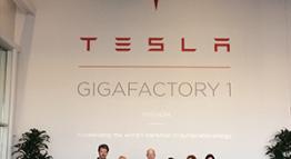 Trustees pose in Gigafactory 1