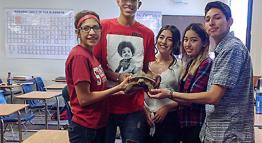 Students Holding a Turtle