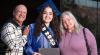 HSE graduate stands proud alongside her loving family members.